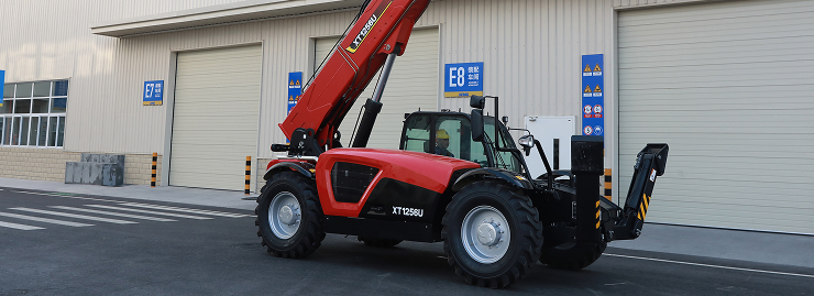 Telehandler outside an industrial facility