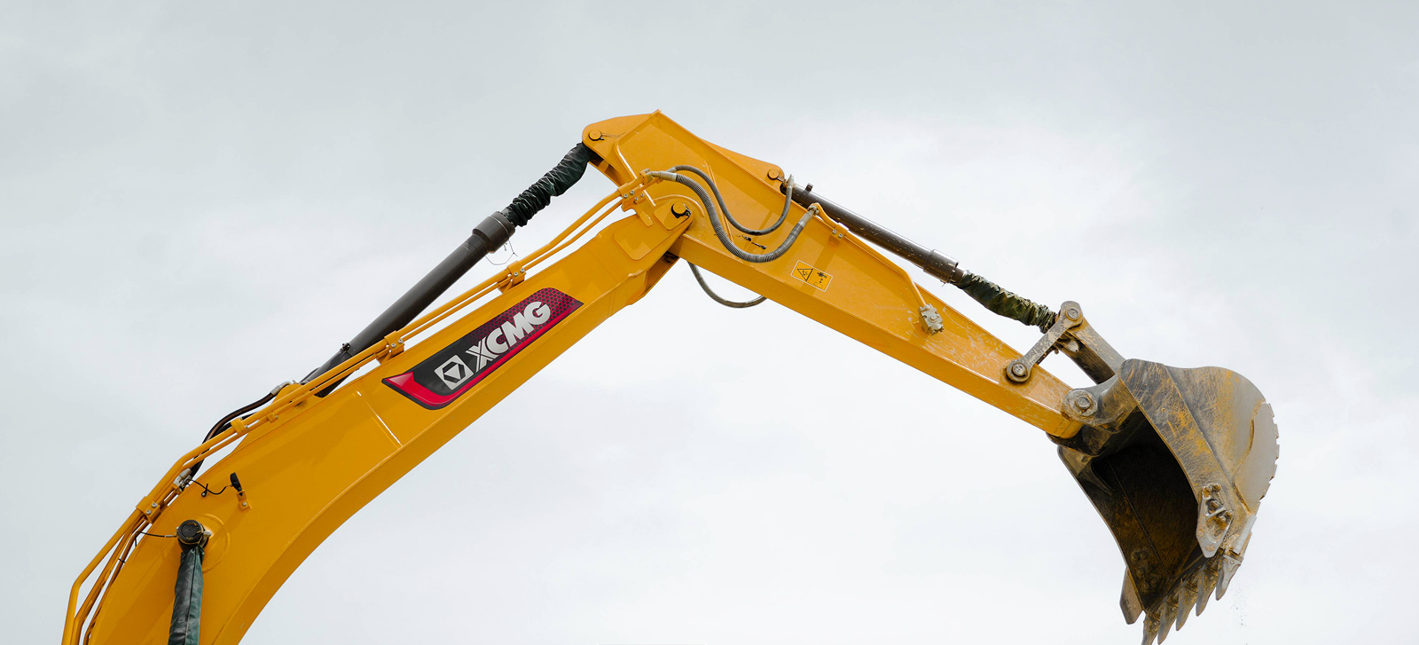Close view of the XCMG XE215C excavator boom and bucket