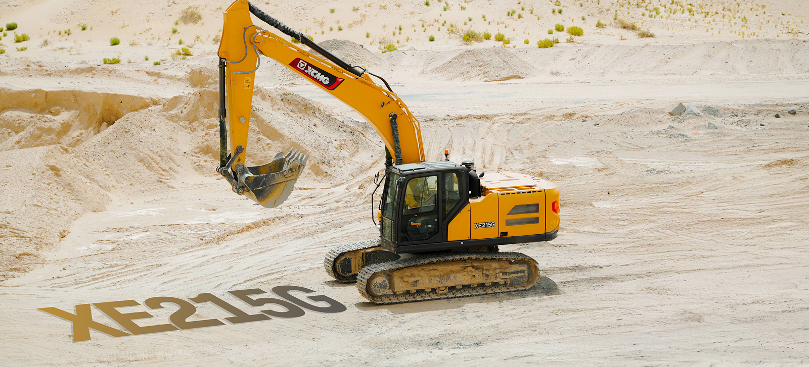 XCMG XE215C excavator on a sandy highway construction site in Abu Dhabi