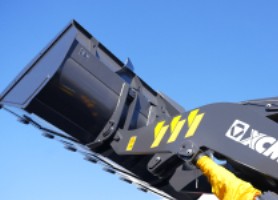 Close-up of XCMG heavy equipment arm against a blue sky